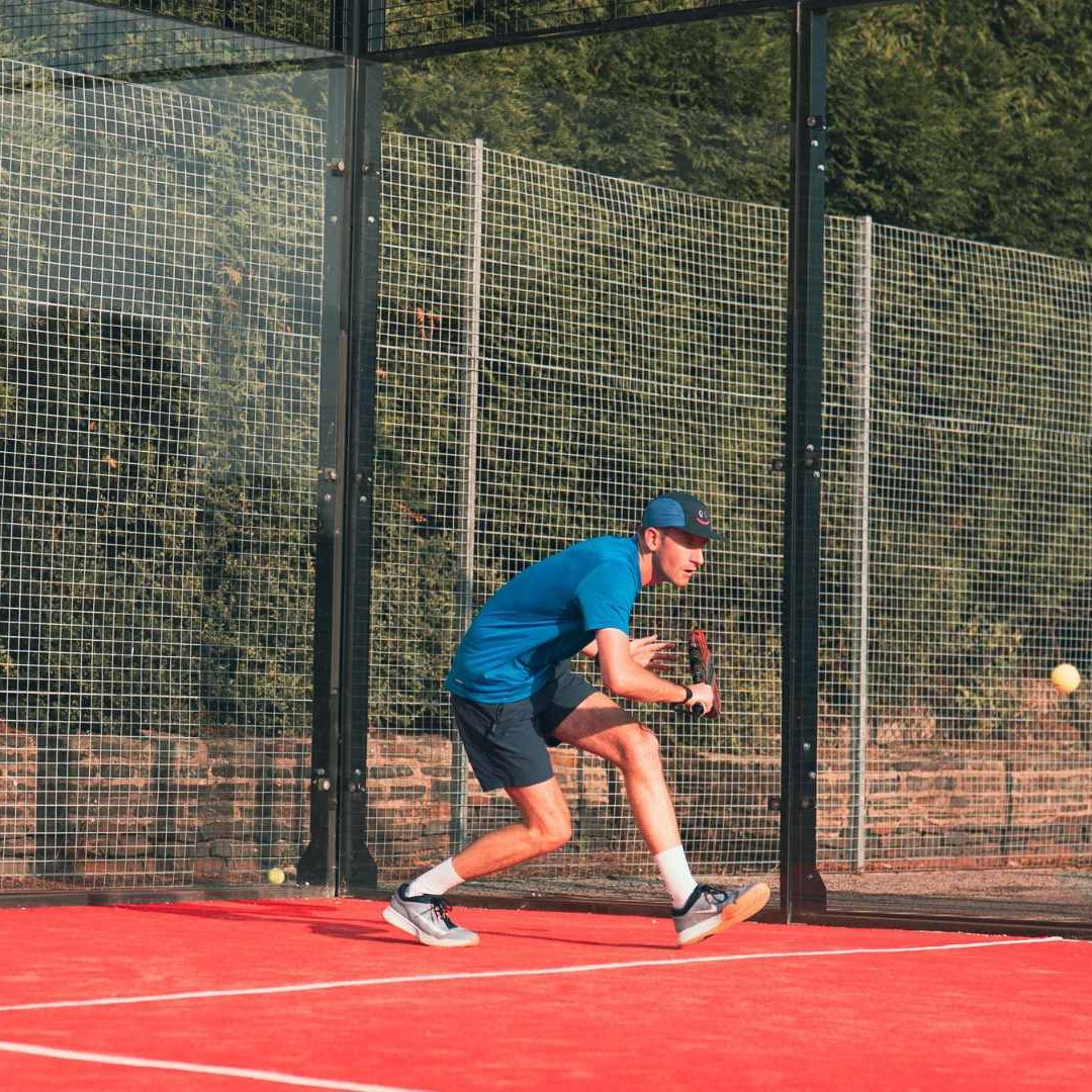 Elevate Padel Society Player Returning Shot
