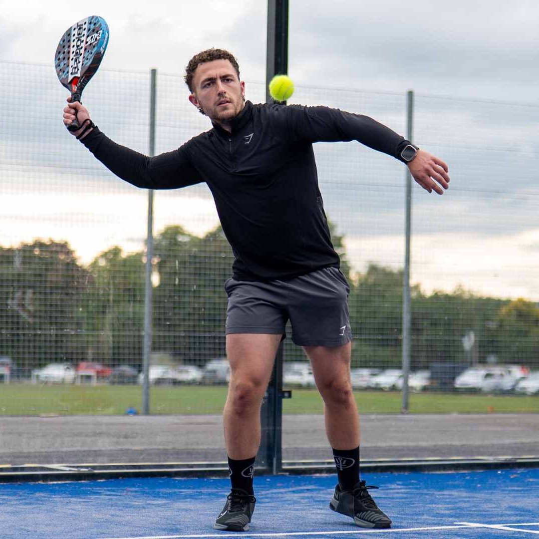 Elevate Padel Society - Player Returning Shot