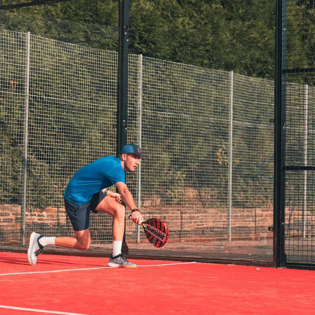 Elevate Padel Society - Player on Red Court