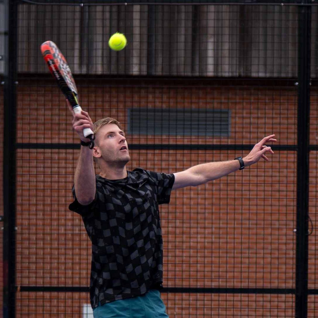 Padel Player Hitting a Voley